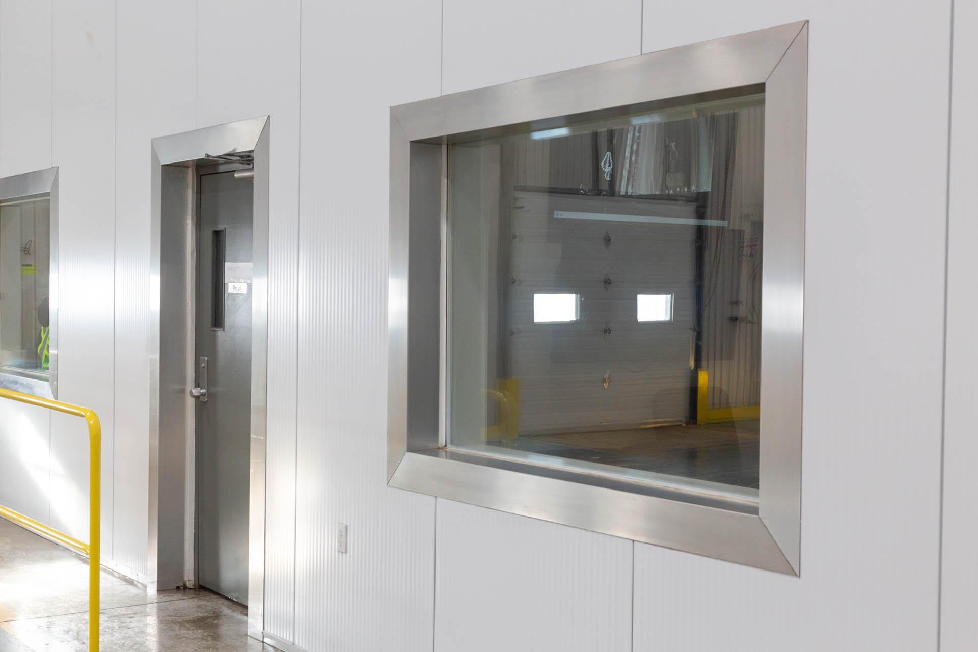 Steel-framed window embedded in an industrial building wall